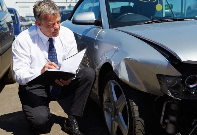 auto insurance agent discussing policy options with customer